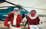 Mr. & Mrs. Clause Arrive By Helijet Image